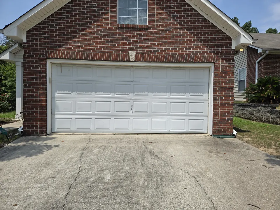 White raised-panel double door, Ross Bridge, Hoover, AL: a Golden Garage Door Services job
