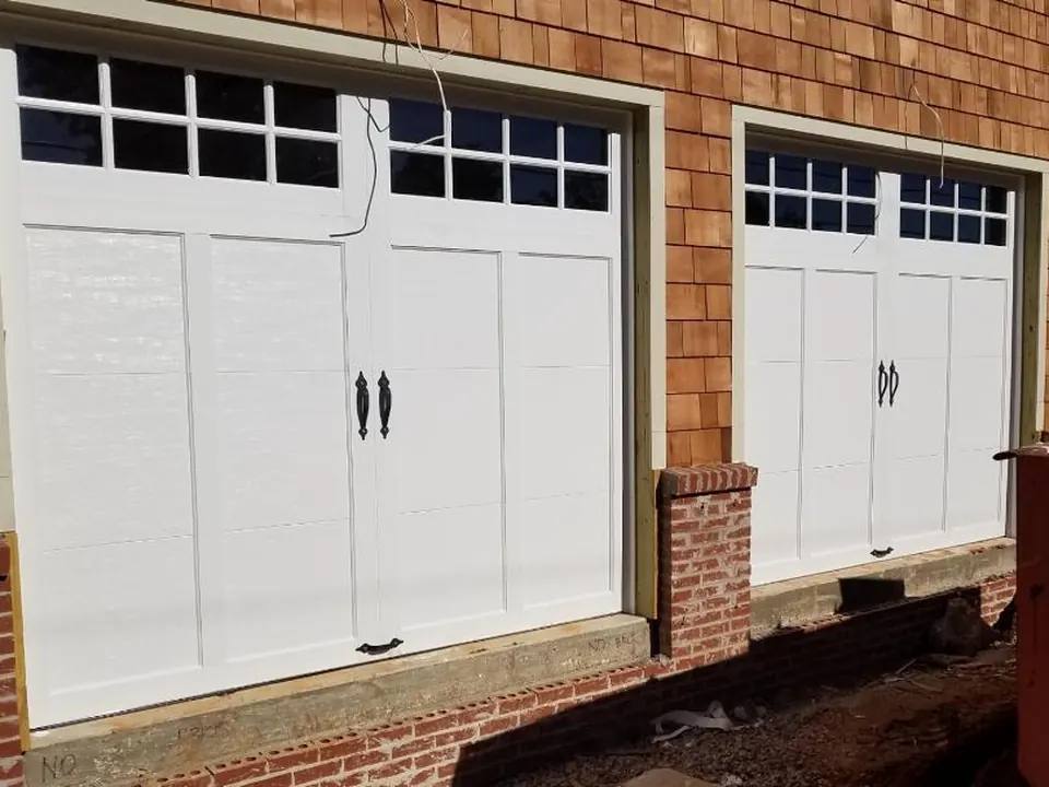 White carriage doors with windows: a Golden Garage Door Services job
